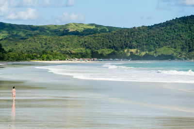 Scenic view of beach and sea against sky