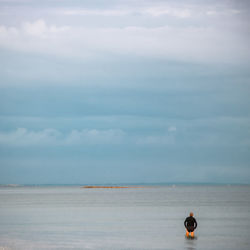 Rear view of man in sea