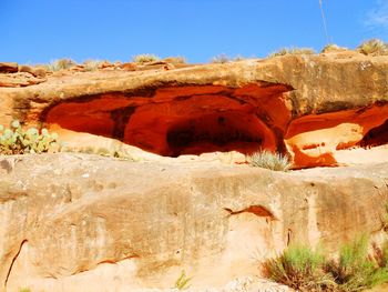 Rock formations against clear blue sky