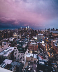 Cityscape against cloudy sky