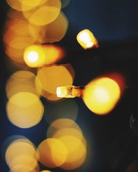 Low angle view of illuminated yellow lights