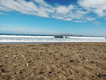 Surface level of beach against sky