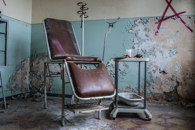 Abandoned dentist chair in clinic