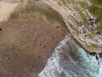 High angle view of water flowing through rocks