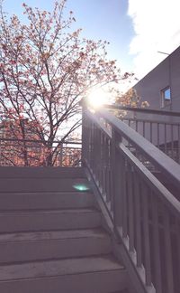 Sunlight falling on railing against sky