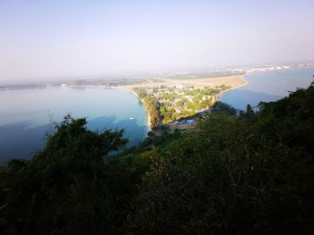 High angle view of lake and trees against sky