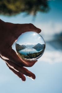 Cropped hand holding crystal ball