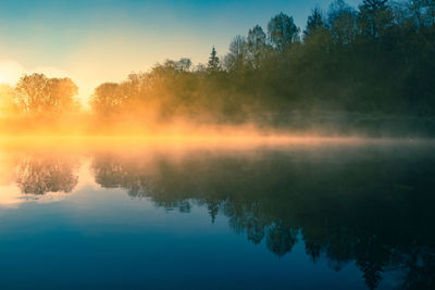 A beautiful river morning with mist and sun light. springtime scenery of river banks in europe. 