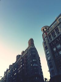 Low angle view of buildings against clear sky