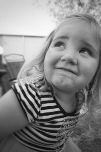 Close-up of innocent girl looking up