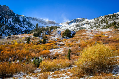 Scenic view of snowcapped mountains against sky during winter