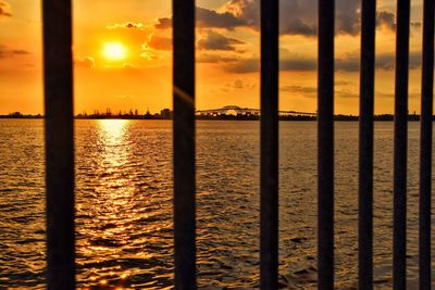 Scenic view of sea against orange sky