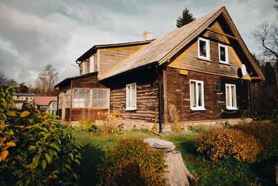 An old wooden house on a sunny autumn day in the countryside of latvia