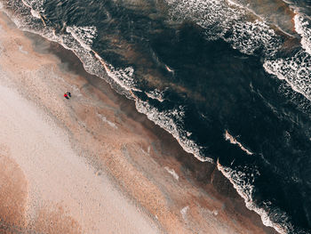 High angle view of waves on beach