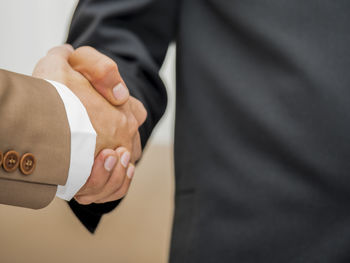 Business people shaking hands at office