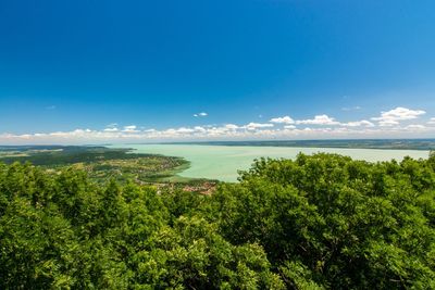 Scenic view of sea against blue sky