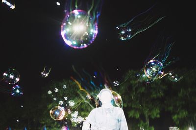 Low angle view of bubbles at night