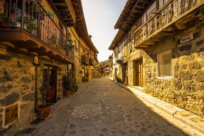 Narrow alley amidst buildings in city