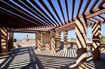 Shades of a structure against sky on sunny day