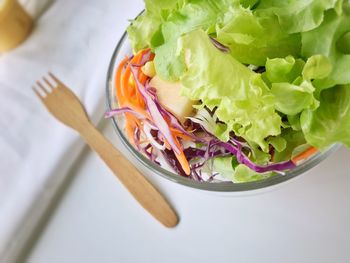 High angle view of chopped vegetables in bowl on table