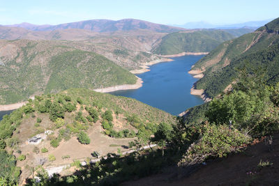 High angle view of trees and mountains against sky