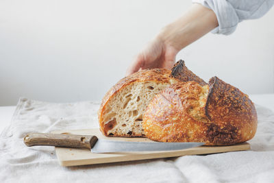 Cropped hand of person preparing food