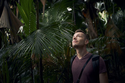 Young man looking away outdoors