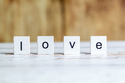 Close-up of love text with blocks on table