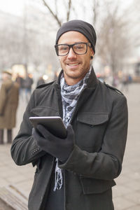 Portrait of young man using smart phone