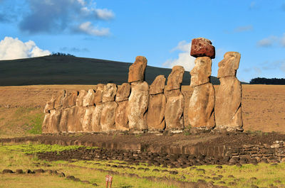 Ahu tongariki, easter island, stone wall on rock against sky