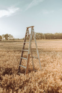 Barn on field against sky