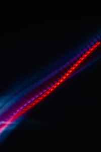 Close-up of illuminated light against black background