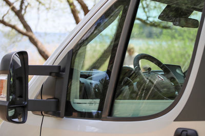 Reflection of car on side-view mirror