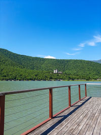 Scenic view of sea against clear blue sky