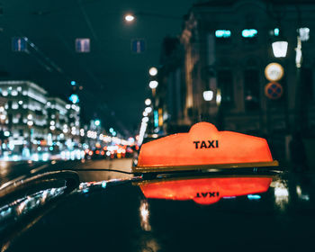 Cropped image of taxi in city