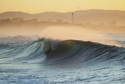 Scenic view of sea against clear sky during sunset