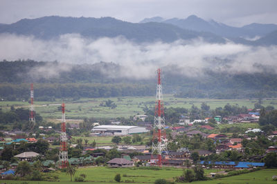 High angle view of trees and buildings against sky