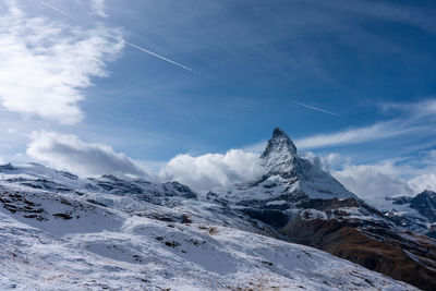 Scenic view of snowcapped mountains against sky