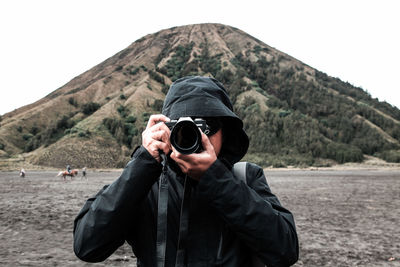 Portrait of man photographing