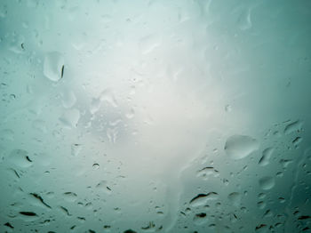 Full frame shot of wet glass window