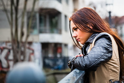 Close-up of woman on street in city