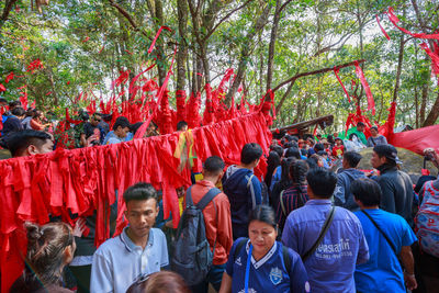 Group of people against plants