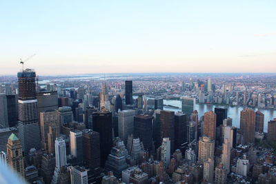 Aerial view of modern buildings in city against sky