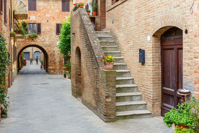 Footpath amidst buildings