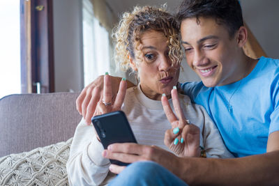 Friends sitting on mobile phone