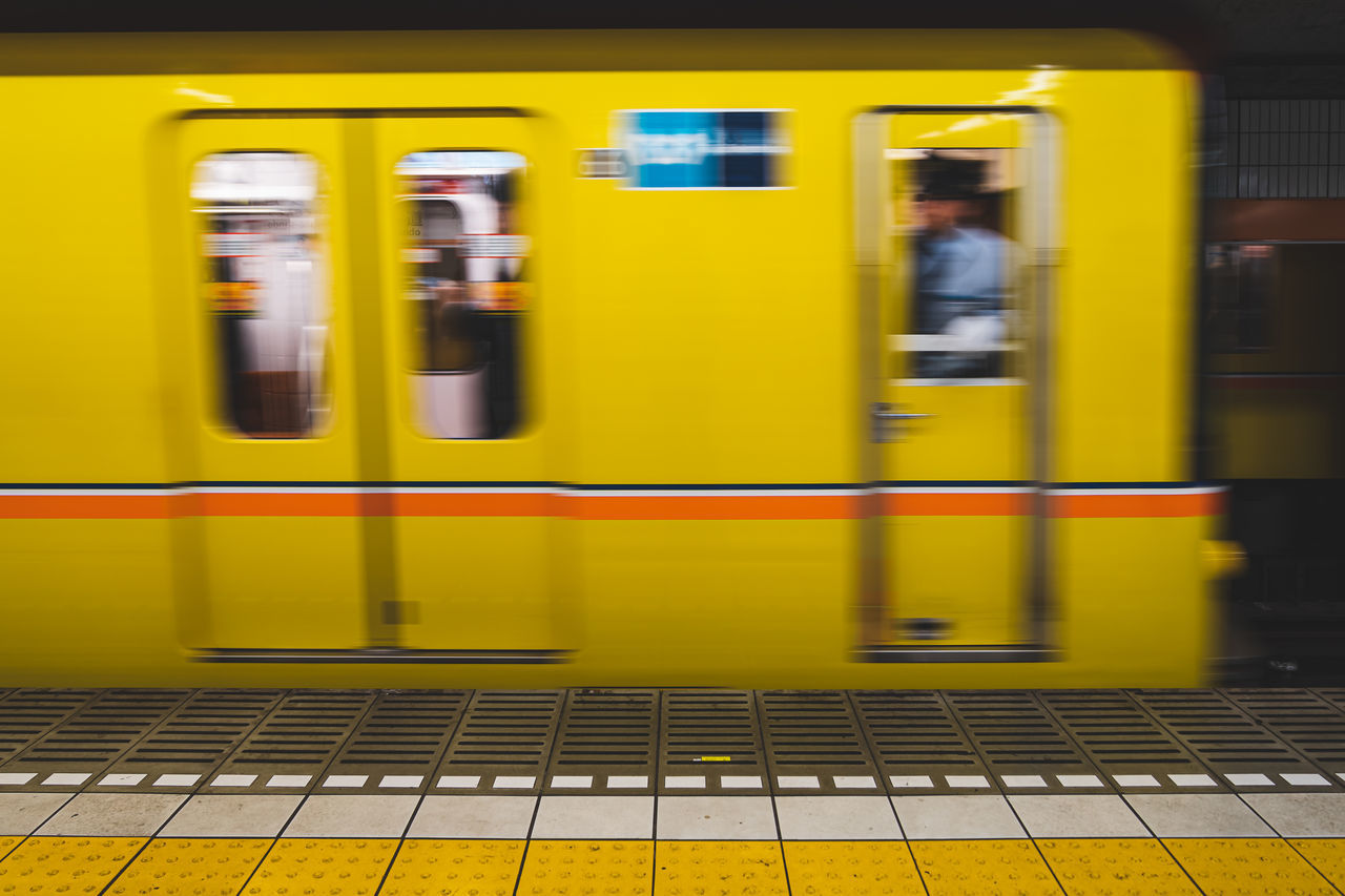 TRAIN AT RAILROAD STATION PLATFORM