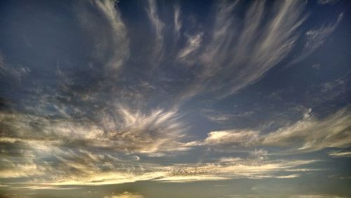 Low angle view of dramatic sky at night