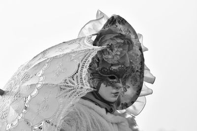 Double exposure of woman against clear sky