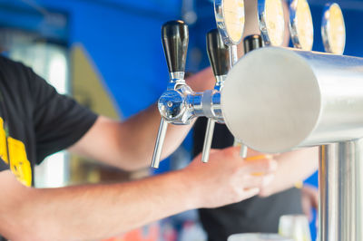 Close-up of hands working at bar