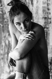 Portrait of beautiful woman sitting indoors